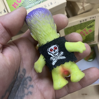 Horny monster - (hand painted green rubber with skull and crossbones denim  vest)