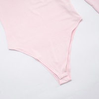 High-neck solid color long-sleeved slim-fit jumpsuit with tassels and a miniskirt - Thumbnail 7