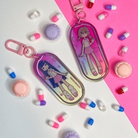 𝒸𝒶𝓅𝓈𝓊𝓁𝑒 𝑔𝒾𝓇𝓁𝓈 holographic keychain - Thumbnail 1