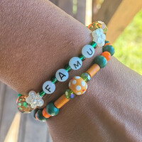 RATTLER PRIDE🐍🧡💚 BRACELET💫 READY-MADE⏳️🎨 By Nubian Collection Artwear 👑 🔹️ SIZE: 6 & 1/2 INCHES 🧿 ONLY ONE AVAILABLE⏳️⏳️ - Thumbnail 4
