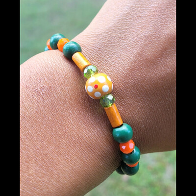 Rattler pride🐍🧡💚 bracelet💫 ready-made⏳️🎨 by nubian collection artwear 👑 🔹️ size: 6 & 1/2 inches 🧿 only one available⏳️⏳️