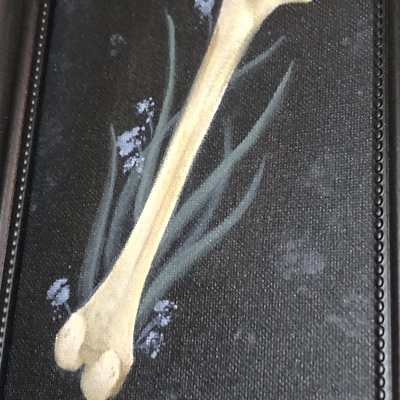 Framed femur bone painting