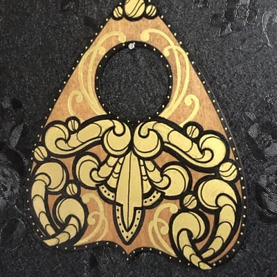 Golden god ouija planchette