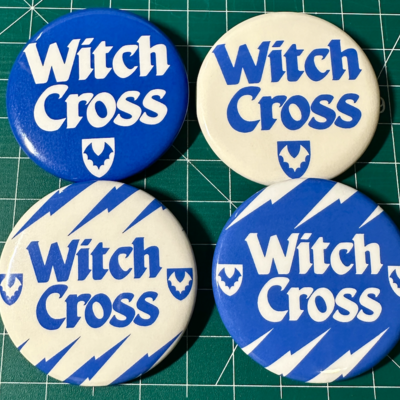 Witch cross pin badge
