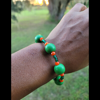 Orange & green me🐍🐍🧡💚 bracelet💫 ready-made (unisex) by nubian collection artwear👑