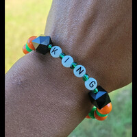 FAMU KING 👑🧡💚 GLOW IN THE DARK ALPHABET BRACELET🐍🐍🧡💚 READY-MADE🎨⏳️ By Nubian Collection Artwear 👑 - Thumbnail 1
