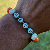 HBCU 🧡💚🐍 GLOW IN THE DARK ALPHABET BRACELET🐍🐍🧡💚 READY-MADE🎨⏳️ By Nubian Collection Artwear 👑 - Thumbnail 1