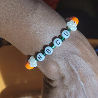 HBCU 🧡💚🐍 GLOW IN THE DARK ALPHABET BRACELET🐍🐍🧡💚 READY-MADE🎨⏳️ By Nubian Collection Artwear 👑 - Thumbnail 2