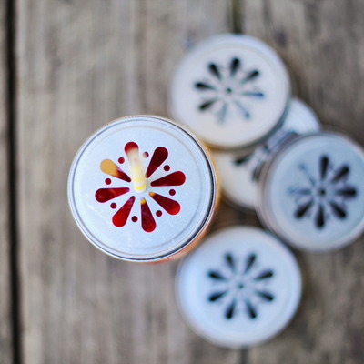 24 daisy stamped mason jar lids 