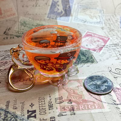 Liquid professor layton teacup keychain