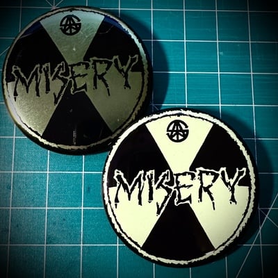 Misery pin badge