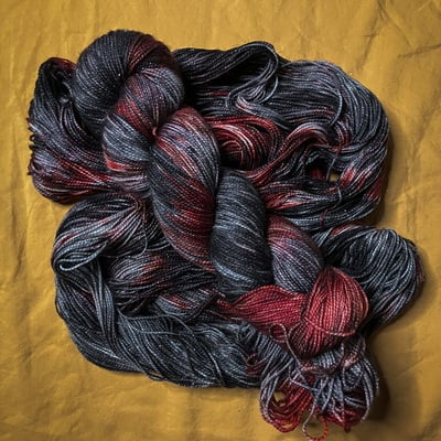 Vampires will never hurt you hand dyed fingering weight sparkle sock yarn