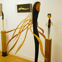 Wooden sculpture by Tach Pollard "Owlman Whispering"  - Thumbnail 2