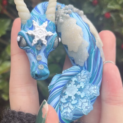 Frost the sleepy blue snowflake dragon