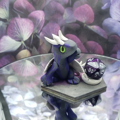 Purple faerie dragon dice guardian