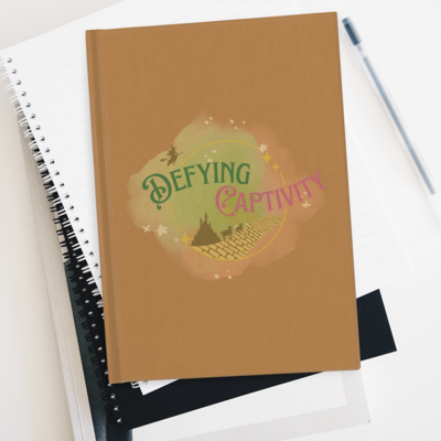 Rule-lined hardcover animal-friendly defying captivity logo journal 