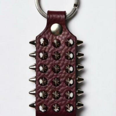 Beautiful silver cone studed keychain in brown and purple color