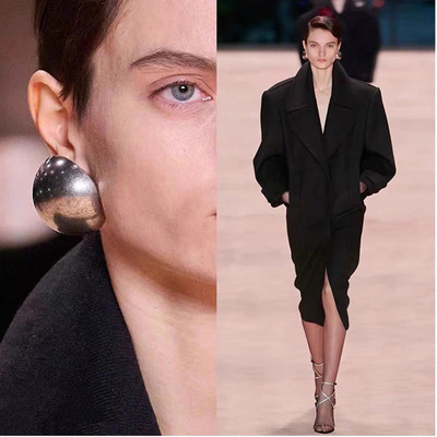 Luxe metallic sphere statement earrings, silver chrome finish, vintage glazed surface, fashion runway style