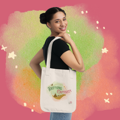 Defying captivity organic canvas tote bag