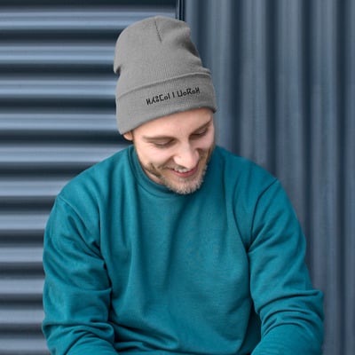 Unique embroidered design, classic cuffed skull cap.