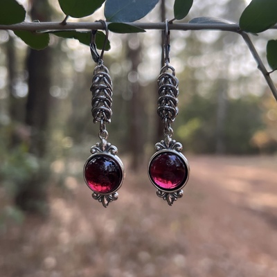 Framed garnet earrings