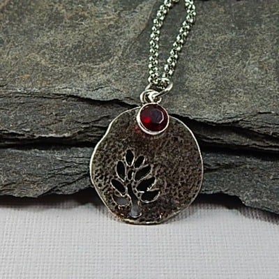 January birthstone leaf pendant necklace - handmade silver leaf cutout with garnet crystal charm