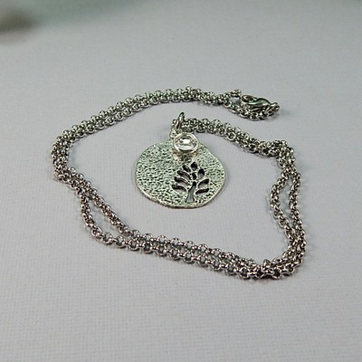 April birthstone leaf pendant necklace - handmade silver leaf cutout with diamond crystal charm