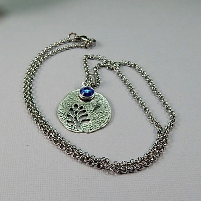 September birthstone leaf pendant necklace - handmade silver leaf cutout with sapphire crystal charm