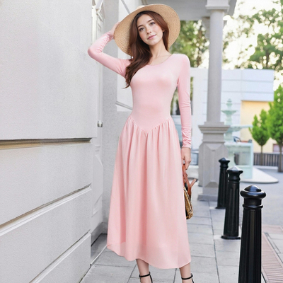 Round-neck, long-sleeved, solid-color, high-waisted dress with a large flared skirt.