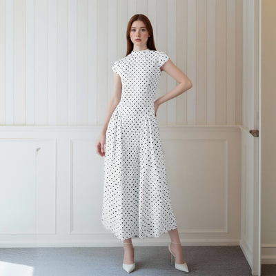 Retro style polka dot print sleeveless round neck fitted high-waisted A-line dress.