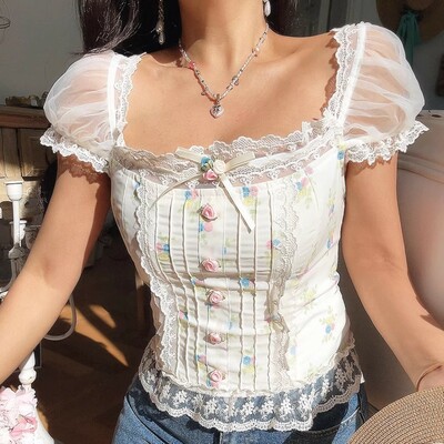 Sexy and sweet lace and mesh patchwork floral print shirt with tie-up detail.