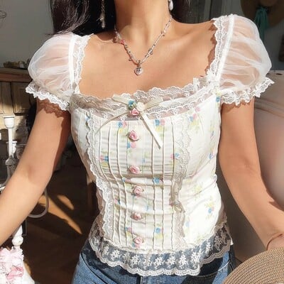 Sexy and sweet lace and mesh patchwork floral print shirt with tie-up detail.