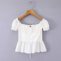 White short-sleeved shirt with lace trim, bow tie detail, and button closure. - Thumbnail 2