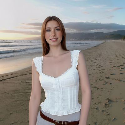 White fitted top with lace trim, elasticated back, and ruffled details.