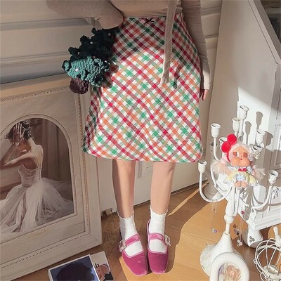 Retro high-waisted a-line skirt with colorful checkered pattern.