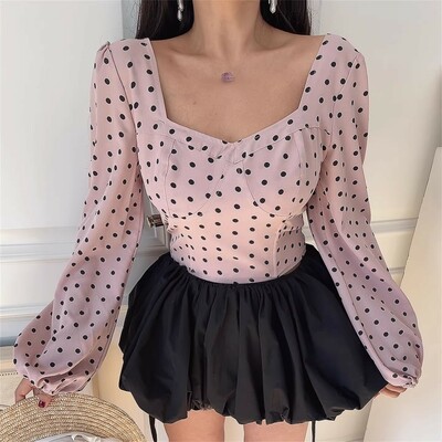 Stylish and elegant t-shirt with puff sleeves, square neckline, and boning detail.