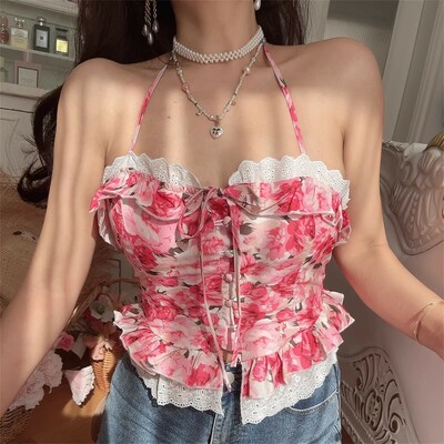 V-neck, halter-neck top with tie closure, floral print, and ruffle details.