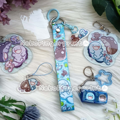 Wooper family phone tether tab with lanyard and charm