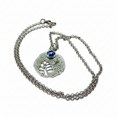 September birthstone leaf pendant necklace - handmade silver leaf cutout with sapphire crystal charm