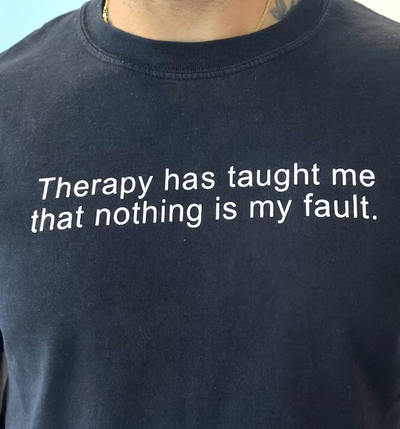 Free Shipping-THERAPY HAS TAUGHT ME THAT NOTHING IS MY FAULT TEE