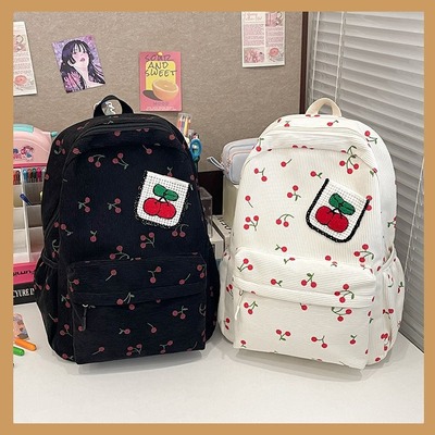 Cherry-patterned corduroy backpack