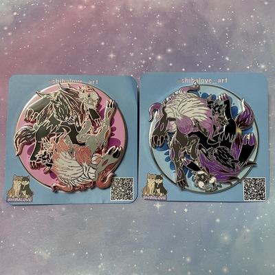 Illusion foxes spinning hard enamel pin