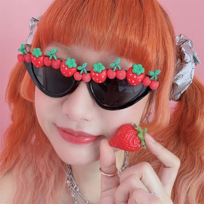 Black cat-eye party sunglasses decorated with small strawberry
