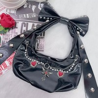 Y2K-style shoulder bag featuring a large studded bow - Thumbnail 3