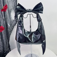 Y2K-style shoulder bag featuring a large studded bow - Thumbnail 2