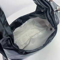 Y2K-style shoulder bag featuring a large studded bow - Thumbnail 4