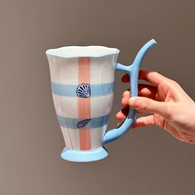 Ceramic mug with a built-in hollow straw handle