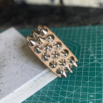 To-patina staggered british stud cuff