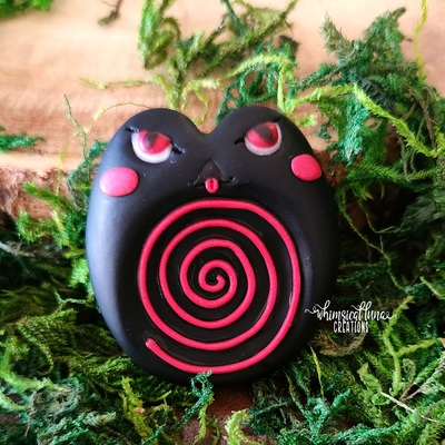 Angry black frog