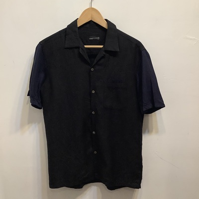 Lad musician open collared fender shirt 